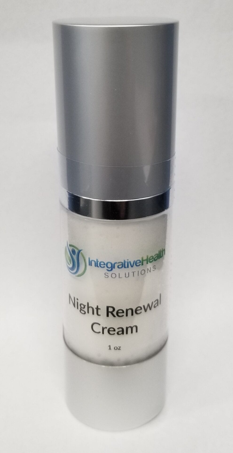 A bottle of cream that is sitting on the floor.